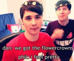 two young men sitting at a table with flowers in their hair and the words dan we got the flower crowns philly i feel pretty