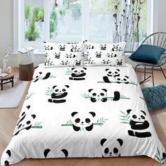 a bed with panda bears on it in a room