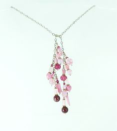 Vintage Czech glass beads in all shades of pinks and rose pair with modern Czech glass beads.  These beads are a mix of molded glass and handmade glass beads.  Each has its own details and together they are a great one of a kind necklace.  A touch of Swarovski crystal gives just the right amount of sparkle.  Each pink bead set dangles from sterling silver chain that can be worn looped high or low.  This necklace has no clasp.  Instead one end is looped over the other in a half knot or however yo Pink Glass Beaded Chain Jewelry, Pink Glass Jewelry With Beaded Chain, Pink Glass Beaded Necklaces For Gift, Pink Glass Jewelry With Colorful Beads, Pink Glass Beaded Necklace For Gift, Pink Glass Necklace With Colorful Beads, Pink Glass Jewelry With Faceted Beads, Elegant Pink Glass Beaded Necklaces, Elegant Pink Glass Beaded Necklace