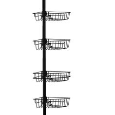 a black and white photo of a pole with three baskets hanging from it's sides