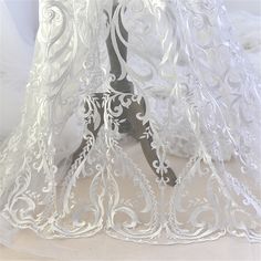 "This stunning Lace Fabric design piece has soft hand feel, It's perfect for weddings, bridal parties, and any events. Shop our large inventory of bridal fabrics. ☆PRODUCT DESCRIPTION : This gorgeous fabric is made on a sheer base with a beautiful flower embroidery throughout. The fabric width is approximately 51\" (130cm) Wide. Color: off-white as in picture Material: Rayon, Polyester ☆ PURCHASING INFORMATION: This fabric is sold by the yard and each Qty you enter will represent 1 yard of fabri Fabric Wedding Dress, Wedding Dress Fabric, Tulle Embroidery, Bridal Lace Fabric, Embroidered Lace Fabric, Wedding Dress Fabrics, Embroidery Lace, Lace Weddings, Diy Dress