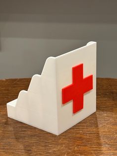 Introducing the ultimate First Aid Box by Bat Country Crafts - your go-to solution for keeping bandages and medical supplies organized and accessible! This isn't just any first aid kit; it's a versatile Bandaid Holder Organizer designed to revolutionize how you store and access your medical essentials.  Whether you need a car first aid kit, a home medical station, or an office health hub, this compact white medical caddy with its distinctive red cross has got you covered. Why choose our First Ai Car First Aid Kit, Medical Essentials, Medical Supply Organization, Office Health, Car Home, Country Crafts, Aid Kit, First Aid Kit, Storage Items