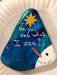 a paper plate with a painted rock that says do you see what i see?