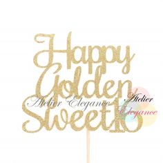 a cake topper with the words happy golden sweet written in gold glitter on it