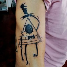 a woman's arm with a tattoo on it that has an image of a man in a top hat