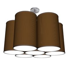 four lights hanging from the ceiling with brown fabric coverings on top and white trim around them