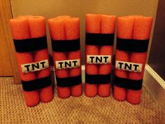 four orange tennis balls stacked on top of each other with the words tnt in between them