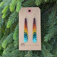 The same beaded fringe earrings you love in a shorter style. Perfect for those days when you are more active, out exploring nature! This unique rainbow color effect is inspired by a vibrant sunset over the ocean. These earrings are very lightweight. A more playful, free flowing option to studs. Featuring 4 strands of hand woven matte glass beads. These unique matte glass beads have a very luxe look and feel to them. Colors: These beaded earrings feature an ombre fade of semi-transparent purple, matte terra cotta, mustard yellow, semi-transparent teal & turquoise glass beads. Length: Approximately 3" drop length Metal Options: Available in 14k gold fill or sterling silver. (Gold-filled jewelry has 100x more gold alloy than gold plated and because that layer is so much thicker, it means gold Fun Multicolor Beaded Earrings, Rectangle Beaded Earrings, Rainbow Seed Bead Earrings, Everyday Multicolor Beaded Dangling Earrings, Multicolor Beaded Earrings With Dangling Beads For Everyday, Multicolor Dangling Beads Earrings For Everyday, Everyday Multicolor Beaded Earrings With Dangling Beads, Bohemian Rainbow Beaded Earrings For Beach, Silver Beaded Earrings