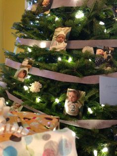 a christmas tree decorated with pictures and lights