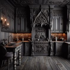 an old fashioned kitchen with wooden floors and black cabinets