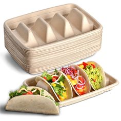 three burritos with different toppings in trays on white background next to an egg carton