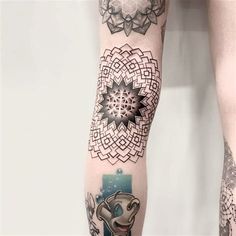 a woman's leg with tattoos on her legs and an elephant in the middle