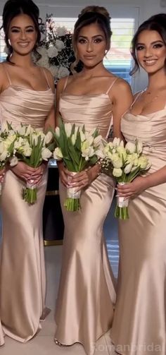 the bridesmaids are all dressed in different styles of gowns and bouquets