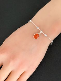 "Natural Carnelian Bracelet, Sterling Silver Beaded Bracelet BRACELET FEATURES: Metal: All components are made from solid .925 Italian Sterling Silver Model is wearing 7\" in length solid .925 Sterling Silver Bracelet Bracelet is secured using a lobster claw Chain Length: 7\". An extension can be applied if needed Stone: Natural Carnelian Pendant Measurements: Height: 22mm, including bail Width: 14mm Please send me a message if you have any questions before or after placing your order. Please vi Spiritual Carnelian Gemstone Bracelet, Carnelian Bracelet Jewelry Gift, Amber Carnelian Gemstone Bracelets, Orange Agate Gemstone Bracelets, Orange Carnelian Gemstone Beaded Bracelets, Orange Carnelian Beaded Bracelet With Gemstone, Orange Carnelian Gemstone Beaded Bracelet, Silver Carnelian Gemstone Bracelets, Silver Carnelian Gemstone Bracelet