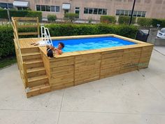 an above ground swimming pool with steps leading up to it and a ladder on the side