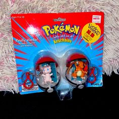 two pokemon action figures are in the packaging