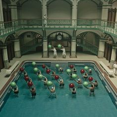 several people are doing exercises in the pool