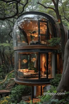 a round house in the middle of some trees