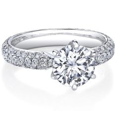 a diamond engagement ring with pave set shoulders