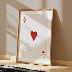 a playing card with the words lucky girl written on it in front of a shadow