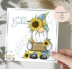 someone holding up a birthday card with sunflowers on it