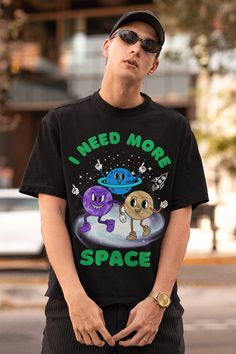 Space Tshirt Cosmic UFO Shirt, Retro Graphic Shirt with Quote Reading: I Need More Space. Order a size or two up for an Oversized look. We offer Free UK Delivery! NOTE TO OUR CUSTOMERS We are a new business and very much appreciate your support! If you love your Tee as much as we hope you do, please leave us a review, thank you in advance- stay cosy and stay groovy! 💚 HOW TO ORDER 💚 1. Check our photos for sizing and colour options. 📏 2. Choose your quantity. Feel free to add as many shirts a Space-themed Graphic Print Cotton T-shirt, Space-themed Cotton T-shirt With Graphic Print, Space-themed Graphic Crew Neck Tops, Space-themed Graphic Print Short Sleeve Tops, Space-themed Short Sleeve Top With Graphic Print, Gamer T-shirt With Character Print And Crew Neck, Funny Crew Neck T-shirt With Character Print, Gamer Graphic Print Short Sleeve Tops, Black Cotton Space-themed T-shirt