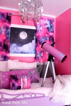 a bedroom with pink and purple walls, white furniture and a telescope in the corner