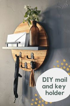 a round wooden shelf with hooks on it and a potted plant next to it