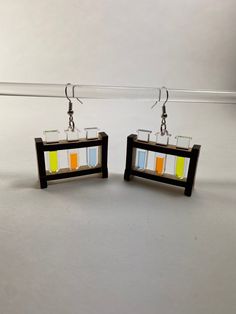 "Science! These earrings are like having a tiny chemistry lab with you at all time.  Kinda. None of the test tubes are actually functional, so you'll have to find another way to run your experiments. These earrings are laser cut and assembled from 1/8\" alder wood and 1/8\" acrylic. They measure approximately 35mm (1.5 inches) wide and are about 30mm (1.25 inches) tall. Each earring only weighs about 3.5 grams (1/8th of an ounce), or a little more than an older U.S. penny (one minted between 1944 and 1982 weighs 3.11 grams, newer pennies weigh a bit less).. Earring hooks are Bead Landing™ Small Ball Fishhook Earrings, Silver Finish, Nickel Free." Flask Science, Silly Earrings, Test Tube Rack, Crazy Earrings, Chemistry Lab, Weird Jewelry, Test Tubes, Geek Jewelry, Quirky Earrings