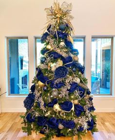 a christmas tree with blue and gold decorations