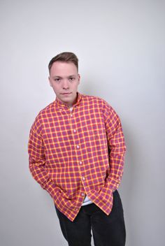 This 90s red plaid shirt is a classic piece that adds a touch of rustic charm to any outfit. The vintage check print, button-up patterned lumberjack shirt features long sleeves, perfect for cooler weather. Made from cotton, it offers a comfortable and breathable fit. The shirt is a size L, with sleeve measurements of 47cm (18.5 inches) from armpit to end of sleeve, a width of 58cm (22.83 inches), and a length of 77cm (30.31 inches), all taken seam to seam while lying flat. Please note that this Casual Gingham Flannel Long Sleeve Shirt, Casual Gingham Shirt For Fall, Casual Long Sleeve Gingham Flannel Shirt, Casual Gingham Long Sleeve Flannel Shirt, Red Relaxed Fit Button-up Flannel Shirt, Red Relaxed Fit Flannel Button-up Shirt, Red Flannel Shirt For Fall, Red Collared Flannel Shirt For Spring, Red Long Sleeve Flannel Shirt