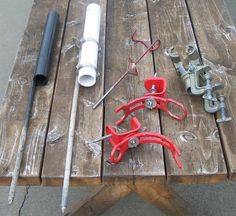 some tools are laying out on a picnic table