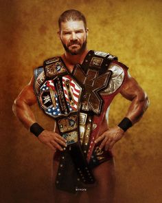 a man in wrestling gear holding his hands on his hips and looking at the camera