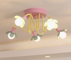 a pink and yellow chandelier hanging from the ceiling