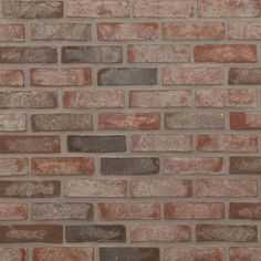 a brick wall that is made out of red and brown bricks, with no mortars or mortars