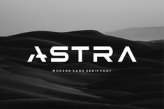 black and white photo of desert with the word astra on it