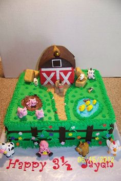 a birthday cake with farm animals on it