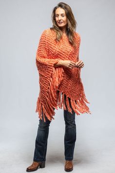 Soliana Cashmere Poncho In Melon Flame - AXEL'S Cozy Chunky Knit Shawl For Fall, Cozy Long Sleeve Cashmere Poncho, Cozy Alpaca Shawl For Fall, Cozy Cashmere Poncho For Winter, Cozy Cashmere Winter Poncho, Cozy Knitted Fall Shawl, Cozy Knit Shawl Sweater, Cozy Cashmere Shawl For Fall, Hand Knitted Knit Shawl For Fall