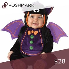 a baby dressed in a bat costume with the words poshmark on it's chest