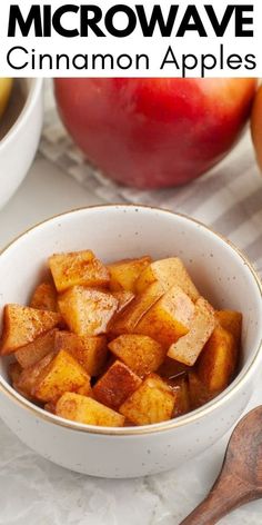 a bowl filled with cinnamon apples on top of a table