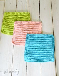 three crocheted dishcloths sitting on top of a white wooden floor next to each other