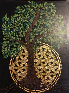 the tree of life is painted on a black canvas with gold and green designs in it