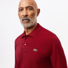 Invented by René Lacoste, the Original L.12.12 has been the epitome of elegant sportswear since 1933. The first polo shirt in history, with its collar, button placket, Petit Piqué knitted with two levels of tension and its crocodile logo made from 2367 stitches, is here complemented with long sleeves. Classic Polo Shirt With Ribbed Collar For Golf, Classic Golf Polo Shirt With Ribbed Collar, Classic Fall Polo Shirt With Collared Neckline, Classic Polo Sweater With Collar And Placket, Classic Fall Polo Shirt, Classic Collared Polo Sweater, Fitted Long Sleeve Polo Shirt For Golf, Classic Long Sleeve Golf Top, Elegant Sportswear