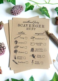 two handmade scavenger hunt cards sitting on top of leaves and acorns