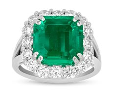 an emerald and diamond ring in white gold