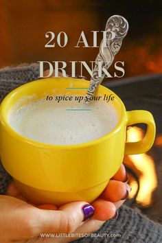 a woman holding a cup of coffee with the words 20 air drinks to spice up your life