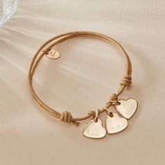 Wear your heart on your sleeve with our Personalized Heart Name Bracelet. Personalize the front and reverse of the mini heart charm with a hand engraved name, date or word, to pair alongside a vibrant braid color of your choice.&nbsp;18K Champagne Gold Plated, 925 Sterling Silver or 18K Rose Gold PlatedMini Flat Heart: 0.4x0.4Braid made of a durable, colorfast polyesterFully adjustable sliding knot fasteningHand-engraved in our Paris workshopSent with love in a complimentary gift boxAny slig Adjustable Heart Pendant Bracelets For Everyday, Adjustable Everyday Heart Pendant Bracelet, Adjustable Charm Bracelet With Heart Pendant, Adjustable Heart Charm Bracelet With Heart Pendant, Adjustable Heart Charm Bracelet, Adjustable Heart-shaped Engraved Name Bracelet, Adjustable Heart Bracelet With Charms, Adjustable Heart Bracelet With Charms For Everyday, Personalized Adjustable Bracelet With Heart Pendant