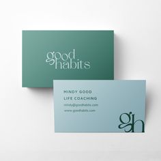 two business cards with the words good habitts printed on them, sitting next to each other