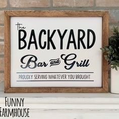 a sign that says backyard bar and grill on the mantle next to a potted plant