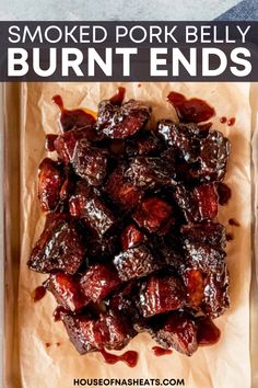 smoked pork belly in a baking dish with text overlay that reads smoked pork belly burnt ends